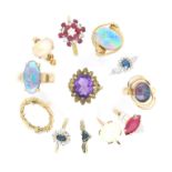 Twelve gem-set gold rings, including an opal cabochon-mounted gold ring, a ruby and diamond