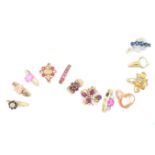 Twelve gem-set rings, including; a ring set with a pink sapphire between circular-cut diamond