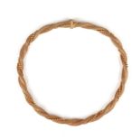 A gold collar necklace, of braided ropetwist design with beaded detail, 18ct London import marks for