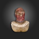 An early 17th century carved hardstone bust, possibly depicting a poet wearing a lace collar,