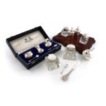 A mixed lot of silver items, various dates and makers, comprising: a three-piece cased condiment