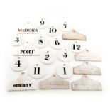 A collection of 19th century ceramic bin labels, comprising: three of hanger form, titled 'PORT', '