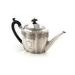 A George III silver tea pot, by John Robins, London 1795, shaped oval form, scroll handle,