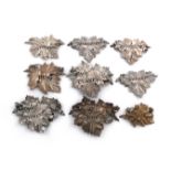 A collection of nine early 19th century silver vine leaf wine labels, various dates and makers,