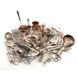 A large collection of old Sheffield and electroplated items and flatware, including a taper stick, a