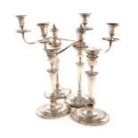 A pair of George III old Sheffield plated candelabra, unmarked, tapering oval form, plain scroll