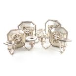 A set of four graduated electroplated wall sconces, makers mark L. B. S. Co, Sheffield, with two