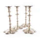 A set of four George III cast silver candlesticks, by William Cafe, London 1762, knopped baluster