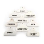 A collection of nine ceramic bin labels, coat hanger form, four stamped Spode, including a pair '