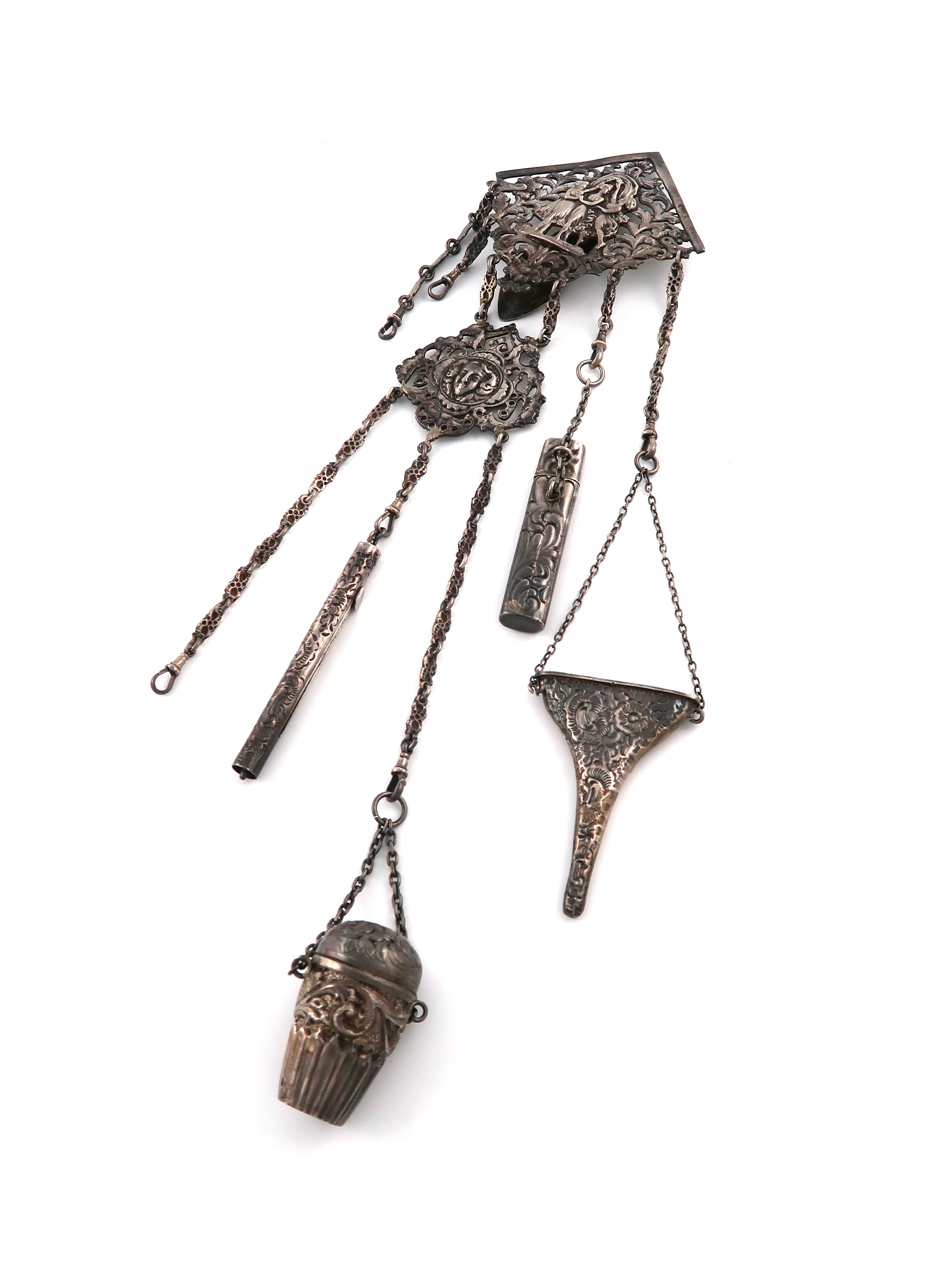 A Victorian electroplated chatelaine, unmarked, the clip pierced and chased with figural and foliate