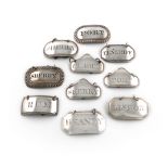 A collection of ten antique silver wine labels, oblong and rectangular form, including a matched set