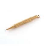 By Asprey, an 18 carat gold 'Gatling' propelling pencil, London 1915, also with a registered