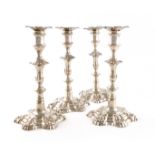 A set of four George II cast silver candlesticks, by William Cafe, London 1757, knopped baluster