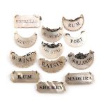 A collection of twelve George III/IV mother-of-pearl wine labels, rectangular and crescent form,