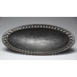 A Rotse oval dish Zambia with a triangle pierced border, 44cm long. Provenance Roger Todd