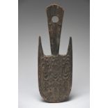 A Lake Sentani suspension hook Irian Jaya, Indonesia with relief carved stylised decoration to