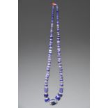 A West African trade bead necklace strung with Venetian graduated chevron glass beads, the largest