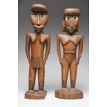 A pair of Micronesia standing figures probably Caroline Islands male and female with inset mother of