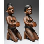 Two Yoruba female cup bearers Nigeria both kneeling and with scarifications to the thighs and