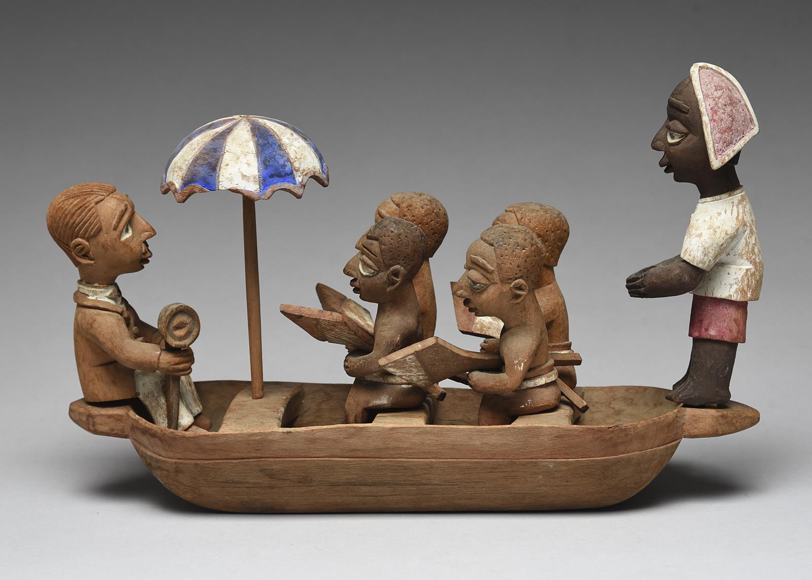 A Yoruba boat group by Thomas Ona Nigeria with a tiller man, four oarsmen with oars, an umbrella and - Image 2 of 4