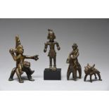 Four Indian bronze figures including the goddess Parvati as Durga astride a tiger and holding a