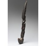 A Solomon Islands figural lever / hook Melanesia the standing figure on a hook, with his hands on