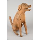 A Nicobar model of a seated dog Bay of Bengal with an open mouth and a yellow wash stain, 50cm high.