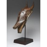 A Guro zamble mask Ivory Coast representing an antelope head with carved and stained decoration,