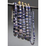 Six trade bead African necklaces chevron glass beads with fibre, the longest 39.5cm. (6)