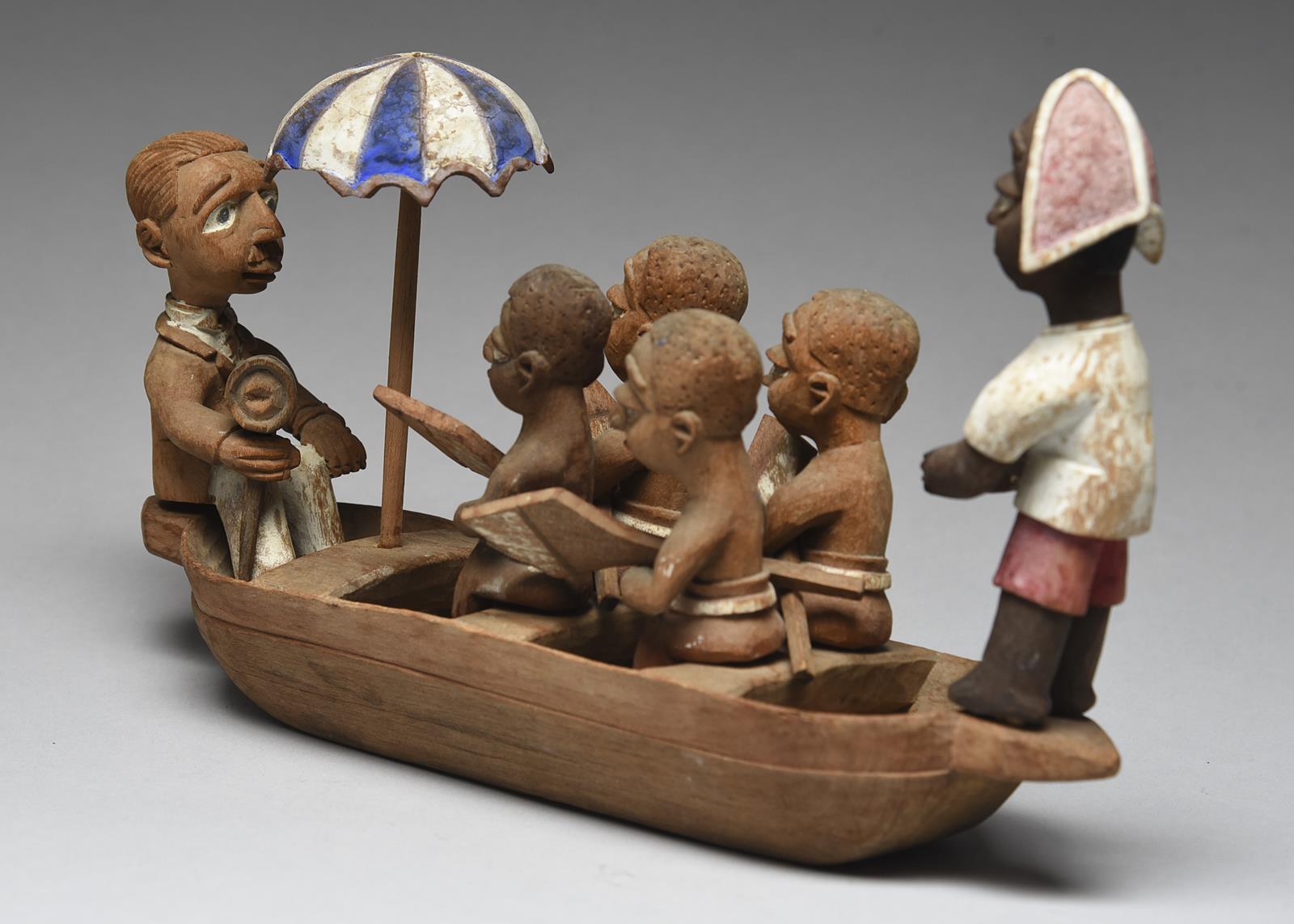 A Yoruba boat group by Thomas Ona Nigeria with a tiller man, four oarsmen with oars, an umbrella and - Image 4 of 4