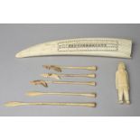 λAn Inuit cribbage board Arctic walrus ivory, carved a walrus and polar bear, 32.5cm long, an