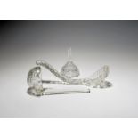 Two cut glass soup ladles and a wine funnel, 19th century, one ladle with a circular bowl and spout,
