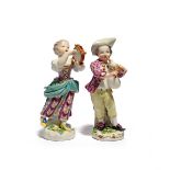 Two Meissen figures of child musicians, 2nd half 18th century, a boy playing the bagpipes and