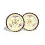 A pair of Worcester dessert plates, c.1770, the wells painted with polychrome sprays of rose and