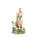 A Derby figure group, c.1775-85, emblematic of Music, modelled with a Classical maiden playing the