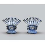 A massive pair of Delft or faïence tulipières, 18th/19th century, of fan shape, each with seven