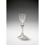 An armorial wine glass, c.1760, of possible Jacobite significance, the round funnel bowl engraved
