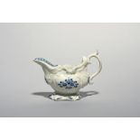 A small Plymouth blue and white sauceboat, c.1768-70, the rococo moulded form painted with panels of