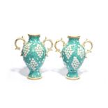 A pair of Chelsea-Derby two-handled vases, c.1770, applied with clusters of small white flowers on a