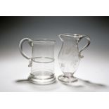 A glass ale jug and a large mug or tankard, c.1760-70, the jug engraved with hops and barley