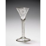 A Jacobite wine glass, c.1750-60, the drawn trumpet bowl engraved with a flowering rose spray with