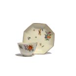 A Chelsea octagonal teabowl and saucer, c.1758-60, painted in the Meissen manner with small flower