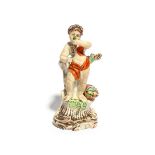 A Plymouth figure of Autumn, c.1770, modelled as a putto standing on a tall scrolled base and