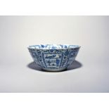 A large Chinese porcelain Kraak type bowl, c.1635-50, painted in underglaze blue to the interior and