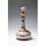 An overlaid glass bottle and stopper, 19th century, the wide flattened base flashed in white over