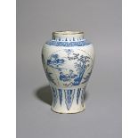 An unusual Delft vase, c.1660-80, the baluster body painted with three fan-shaped panels depicting