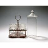 A three jar glass condiment or preserve set, 1st half 19th century, the three cylindrical jars cut