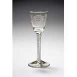 A small Jacobite wine glass, c.1750-60, the round funnel bowl engraved with a rose and bud spray,