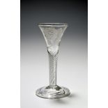 A small Jacobite wine glass, c.1750, the drawn trumpet bowl engraved with a rose and bud spray, an