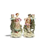 A pair of Derby candlestick figures of the Ranelagh Dancers, c.1760-65, each standing with one